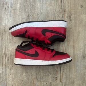 Nike Black and Red Jordan 1s Low-Top Sneakers
